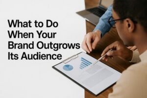 A marketing team reviews data charts and brand insights during a strategy meeting.
