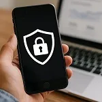 A smartphone screen displaying a security shield with a lock icon, symbolizing website protection and bot prevention — icon for Parrot Branding.