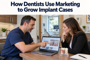 Dentist and marketing professional review a dental implant website together.